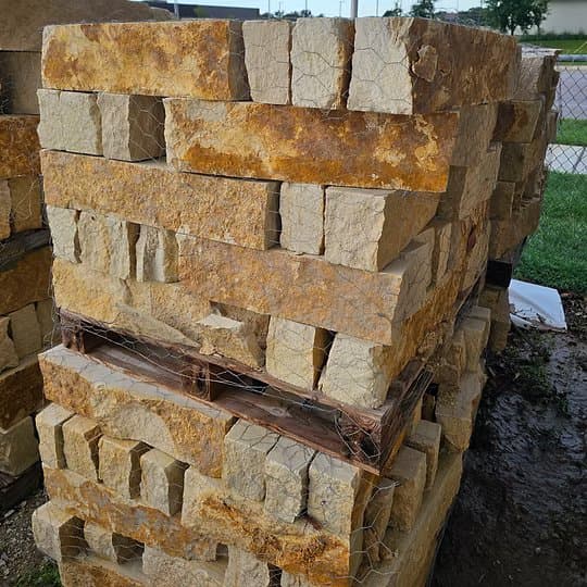 Limestone Nicotine Chopped, a warm-toned Texas limestone building stone, at Round Rock Landscape Supplies™ in Leander TX
