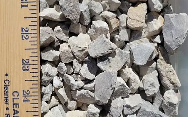 River rock with a ruler for scale at Round Rock Landscape Supplies™ in Leander TX